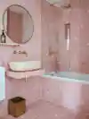 All-pink tiled bathroom.
