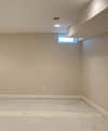 beige empty room with concrete floor