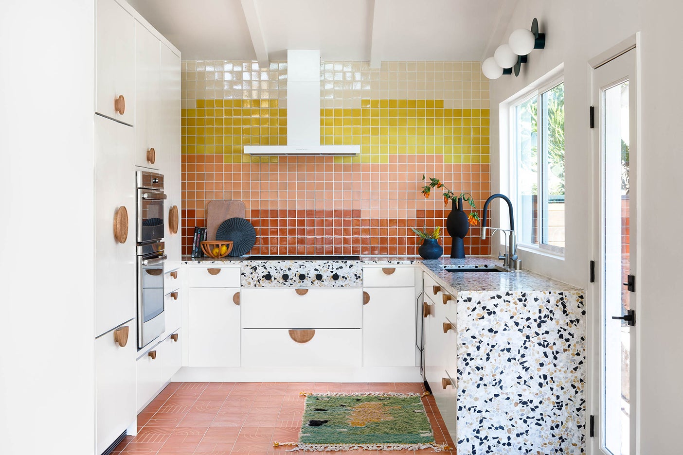 u shaped kitchen with rainbow backsplash