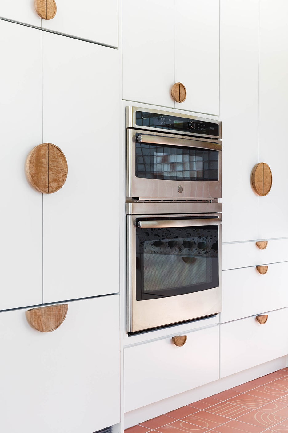 wall oven sourrounded by white cabinets