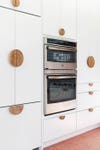 wall oven sourrounded by white cabinets