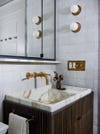 stone sink in wood vanity