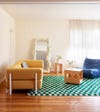 green check rug with yellow couch