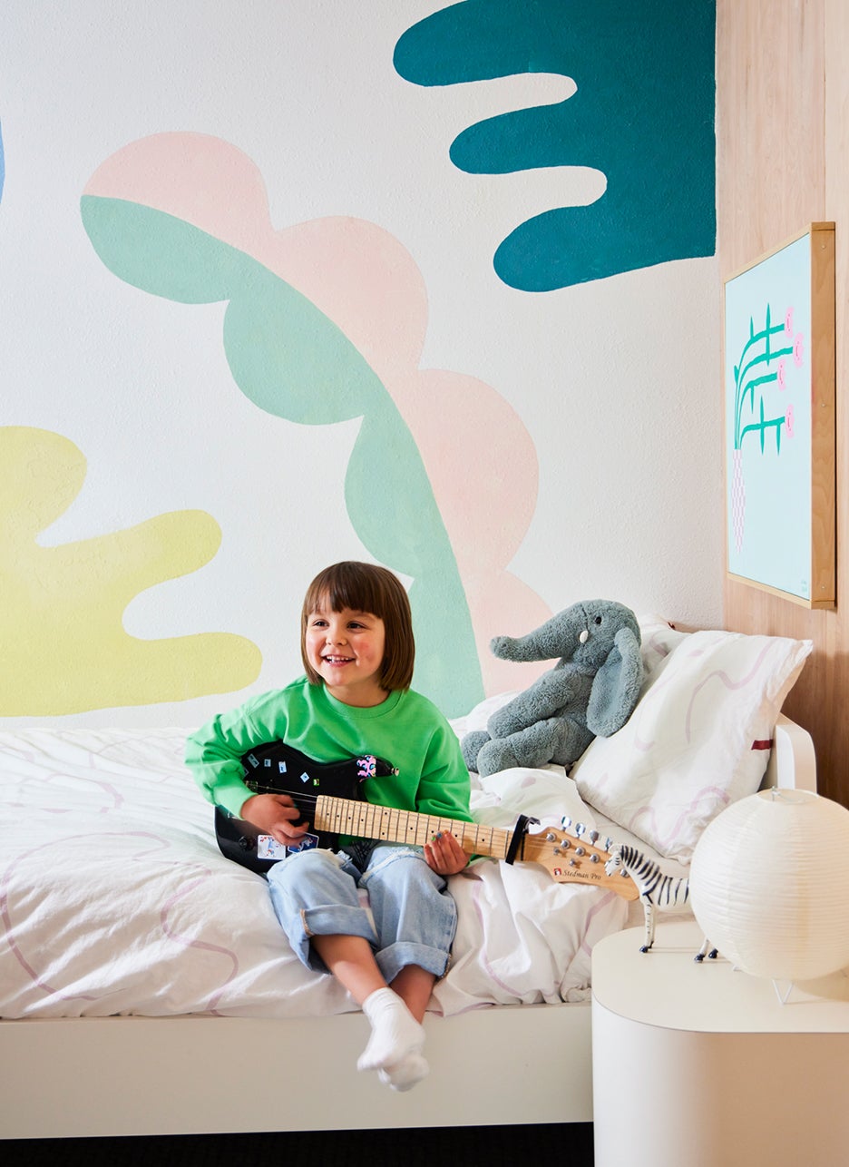 little girl playing guitar
