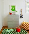 checkered rug and pouf in kids room
