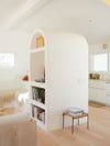 white plastered arch cabinet