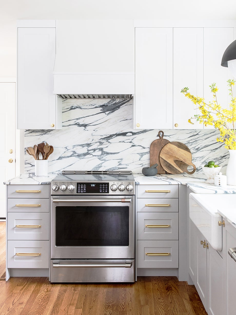 white kitchen with bold stone backspalsh