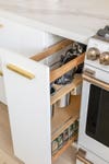 pull out cabinet with cooking utensils