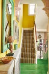 bright yellow stairwell with green floor