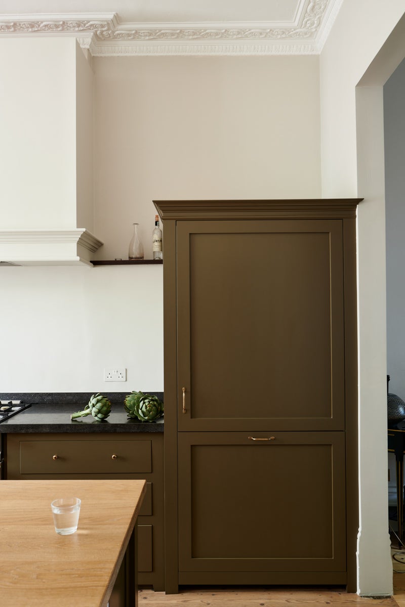 green brown paneled fridge