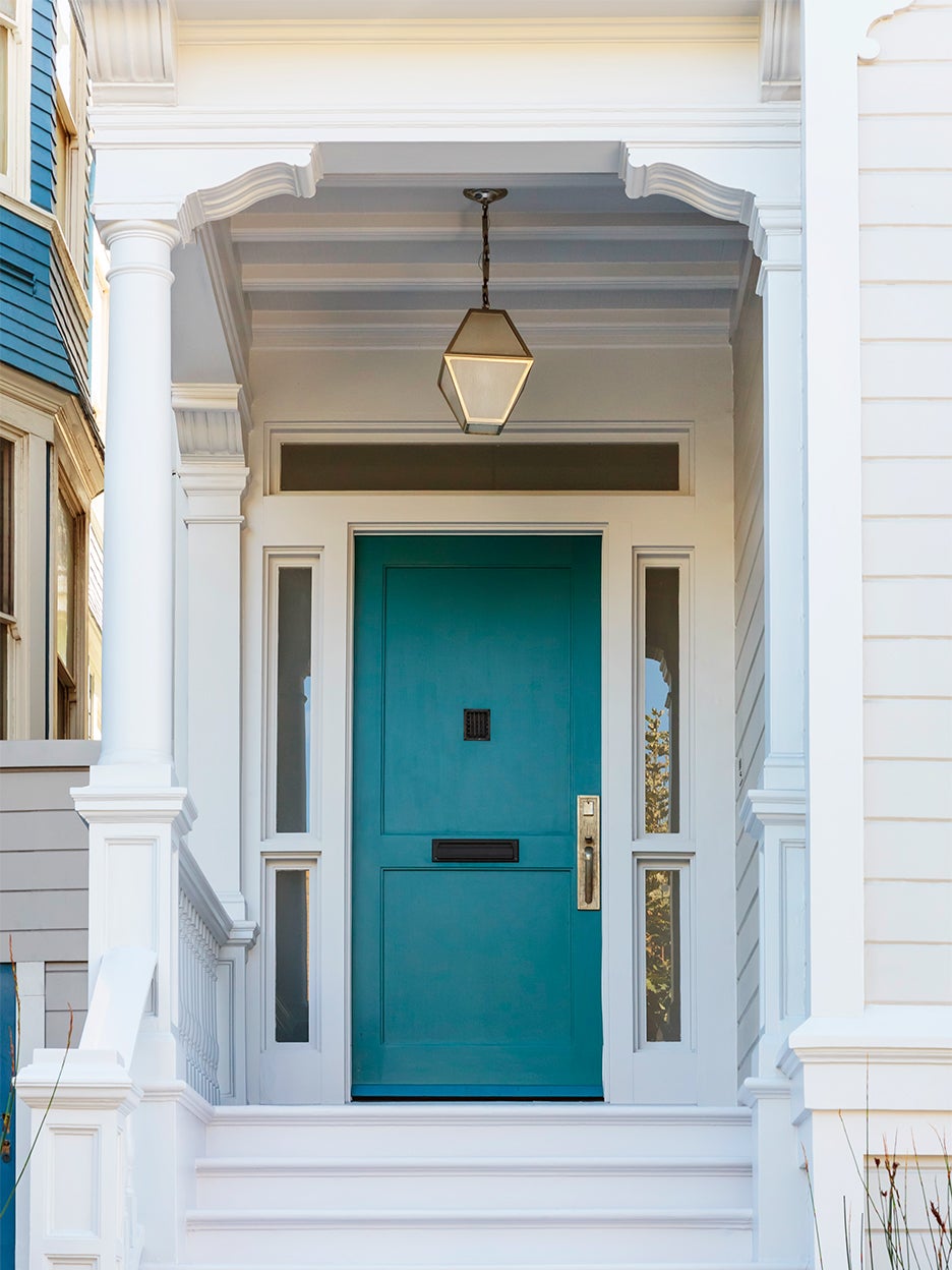 white house exterior with teal front door