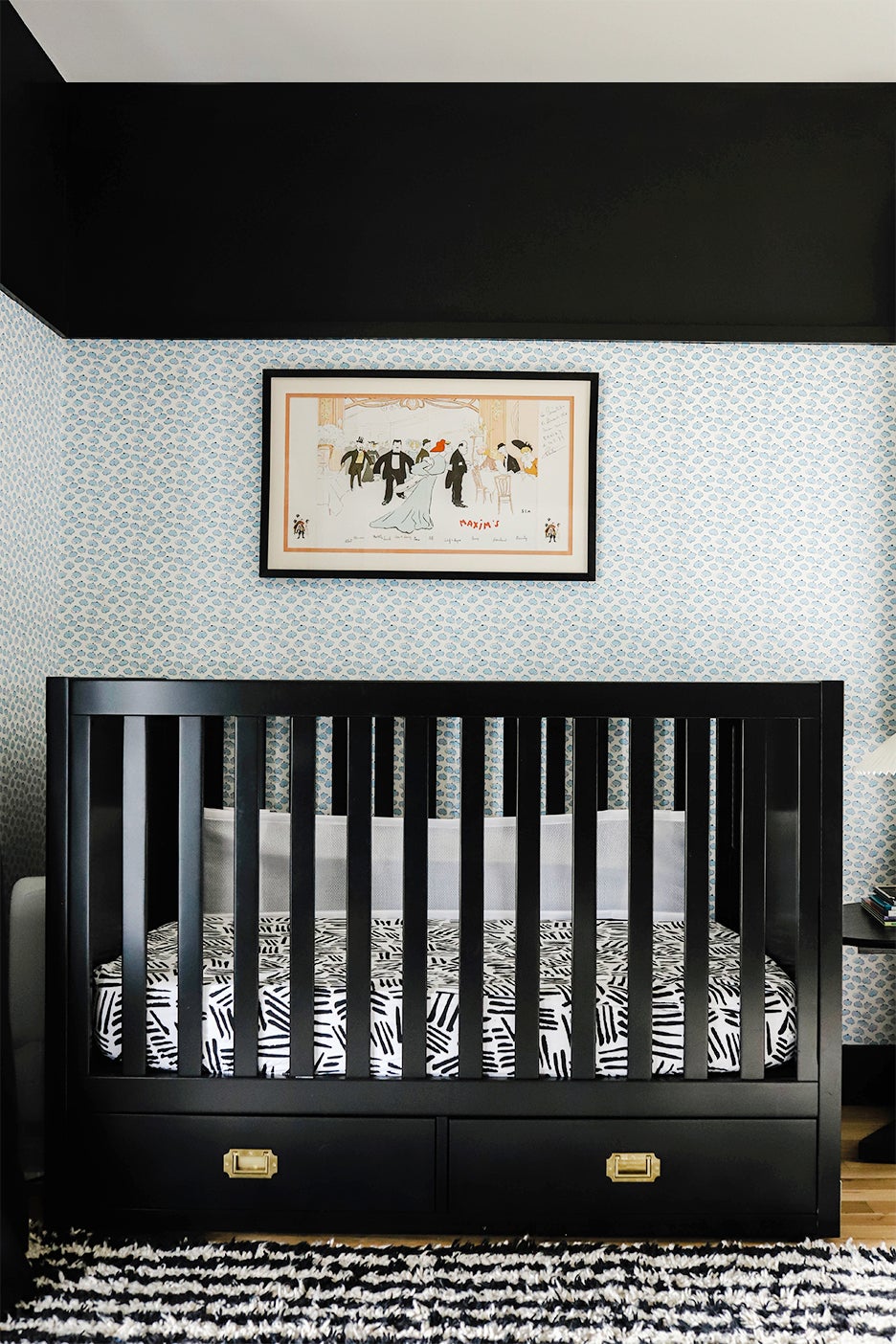 black crib against blue wallppaer