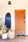 wood front door with surf board