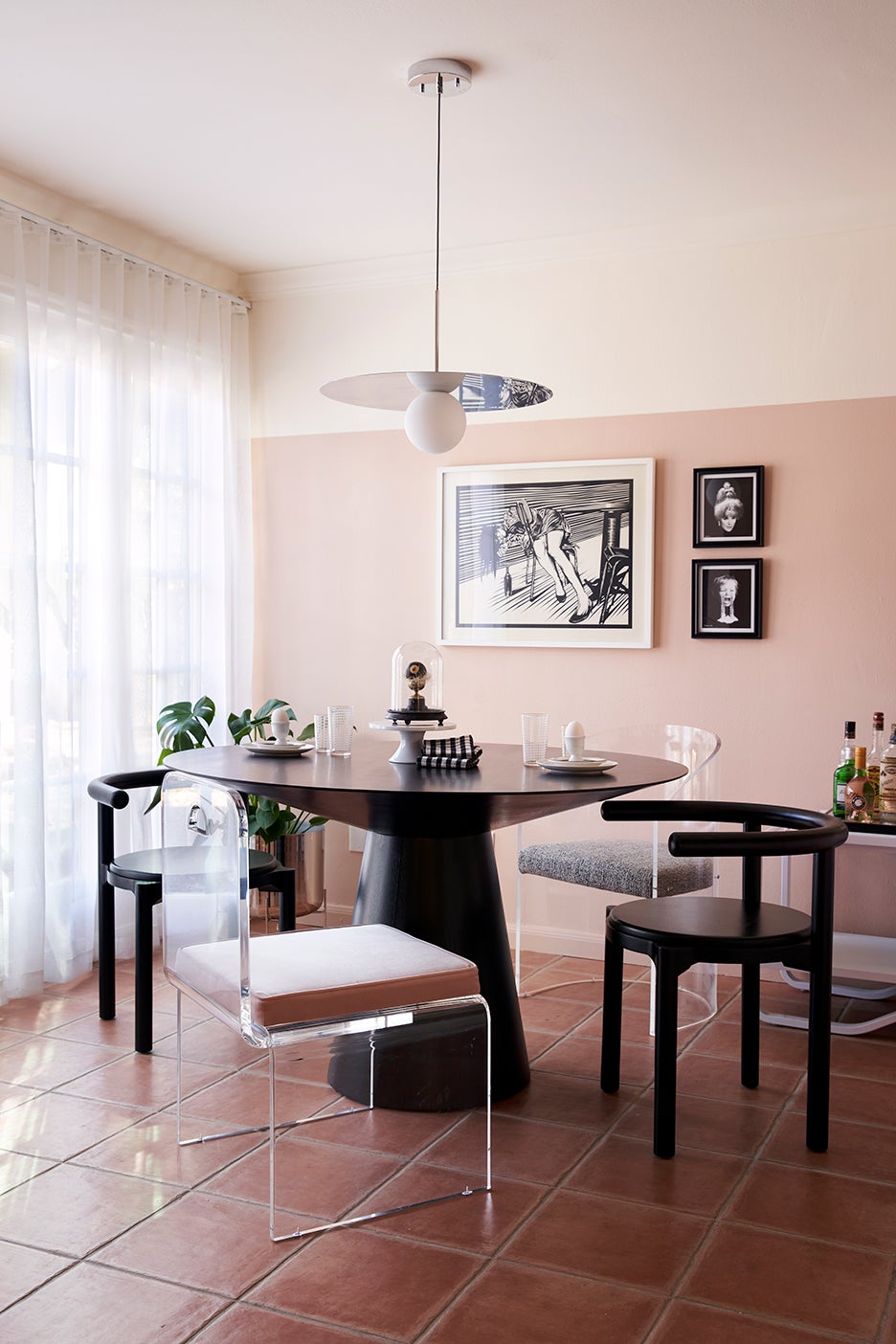 dining room with half pink wall
