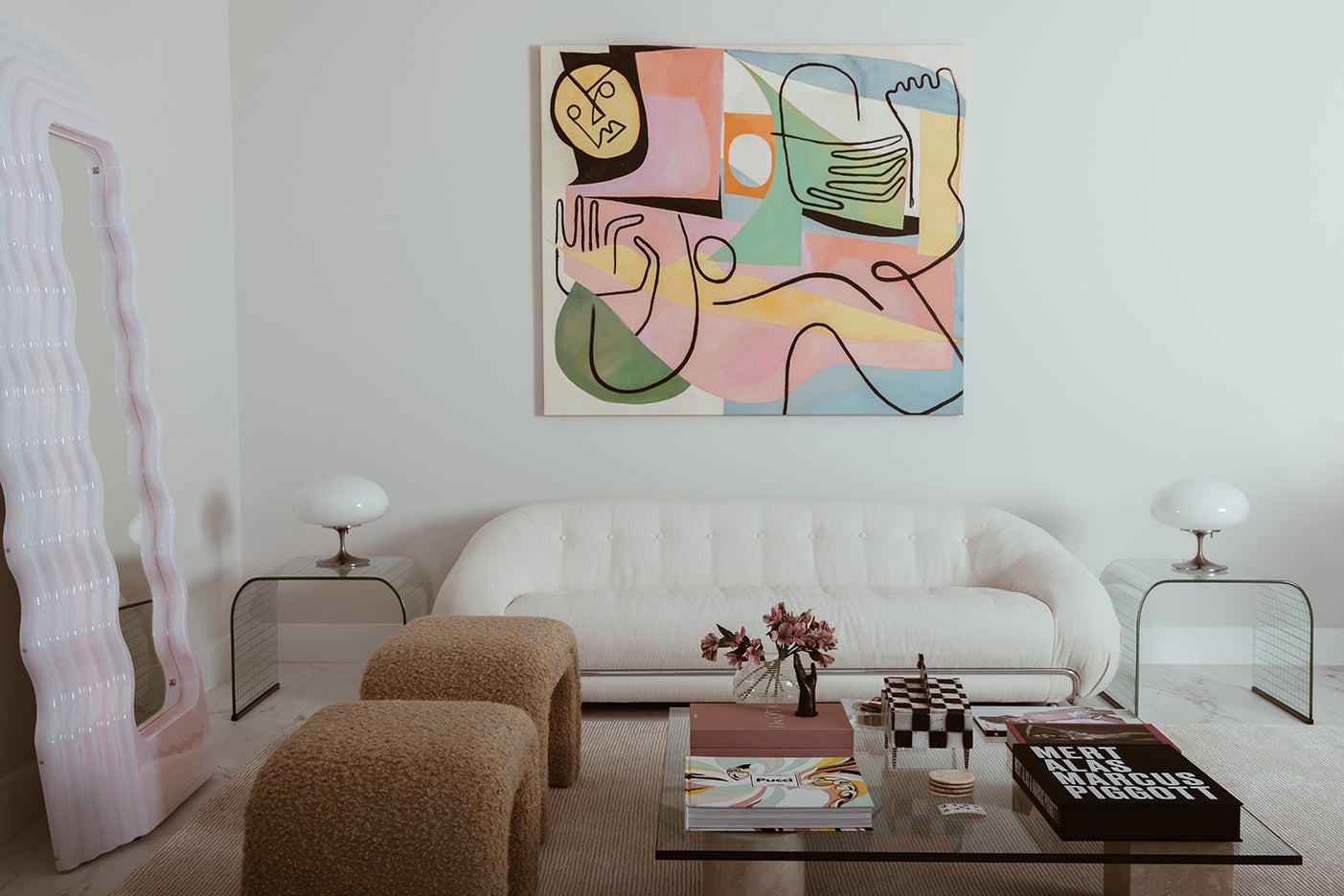 white sofa with colorful abstract artwork above