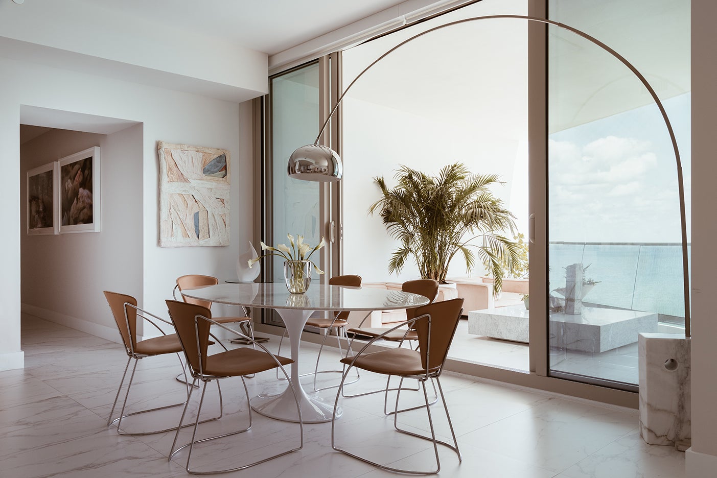 modern dining room with arc lamp