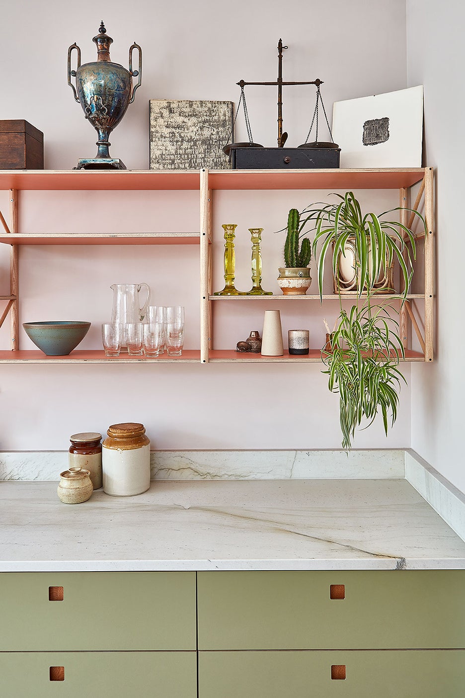 open shelving with pink shelves