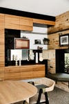 raw wood cabinetry in dining room