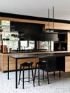 natural wood kitchen cabinets with black island