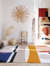 studio space with rugs and sculptures