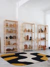 shelves of ceramics in studio space