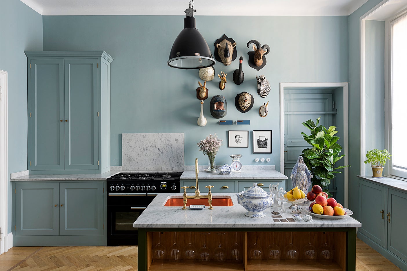 Blue kitchen with faux taxidermy wall