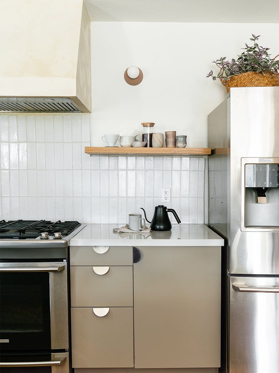 gray kitchen cabinets with white subway tile