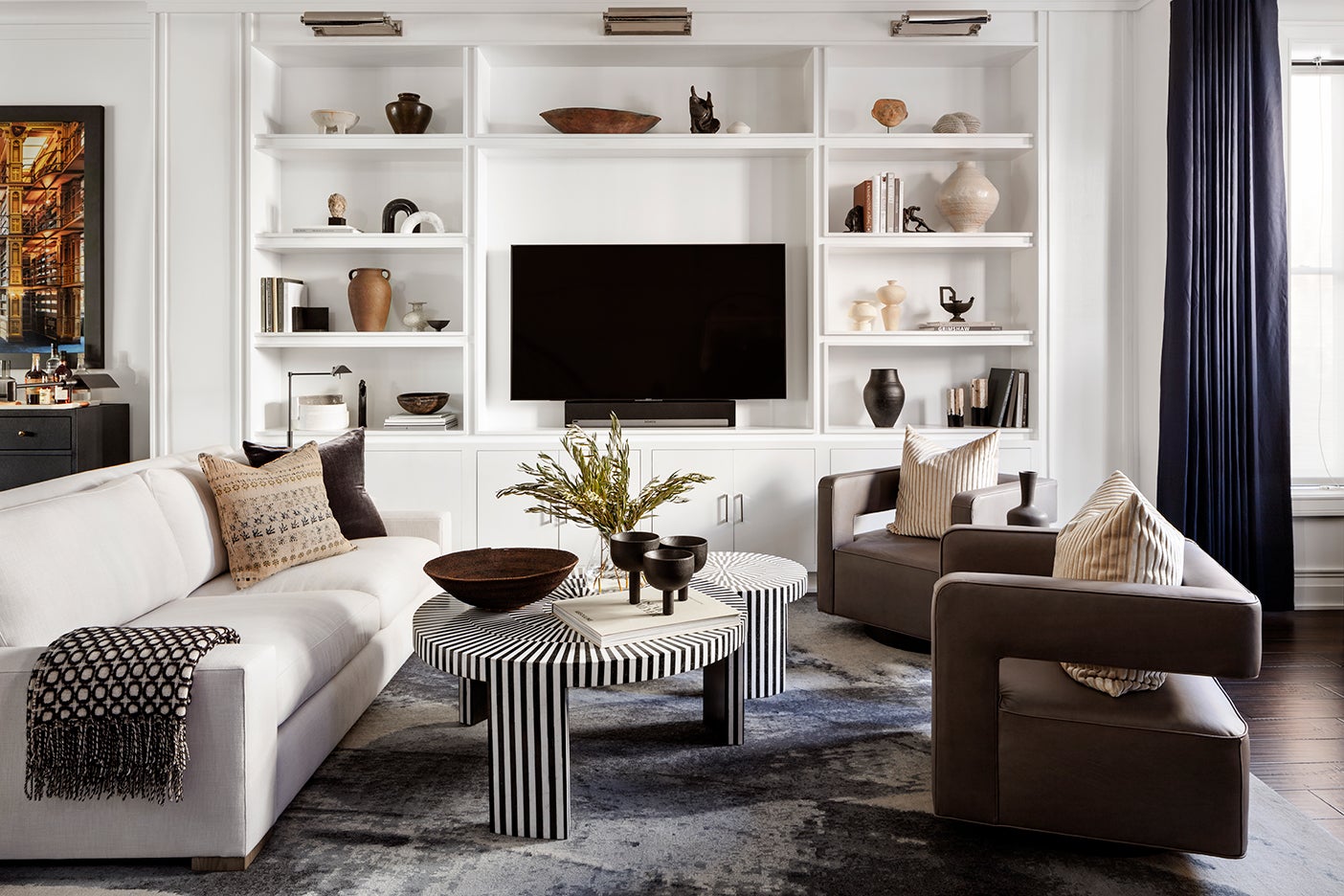 TV area with striped coffee tables