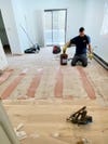 worker installing new wood floors