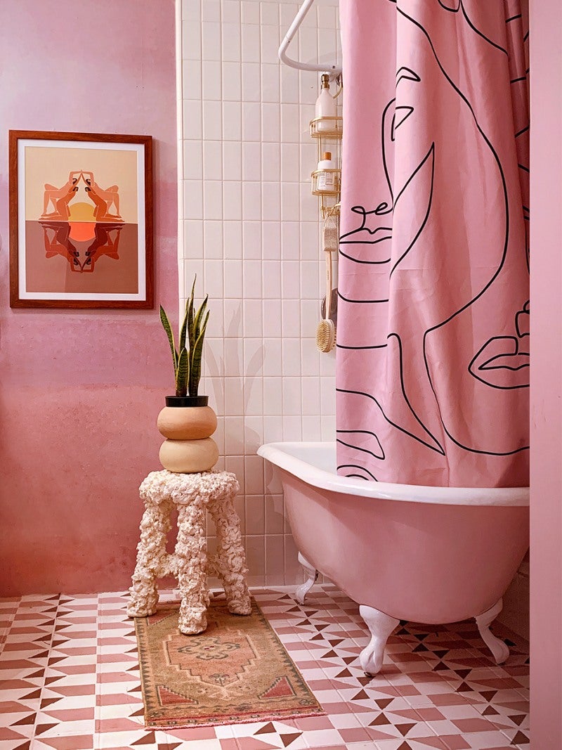 geometric painted tile floor in pink bathroom