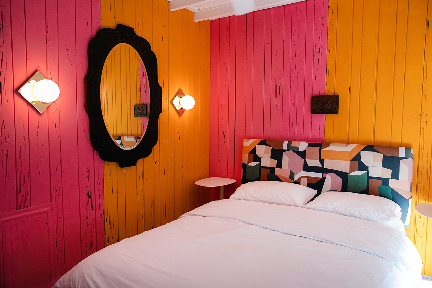 Pink and orange walls on a bedroom