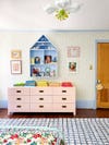 pink dresser and checkered girls room rug