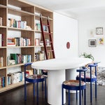 dining room with bookcase wall