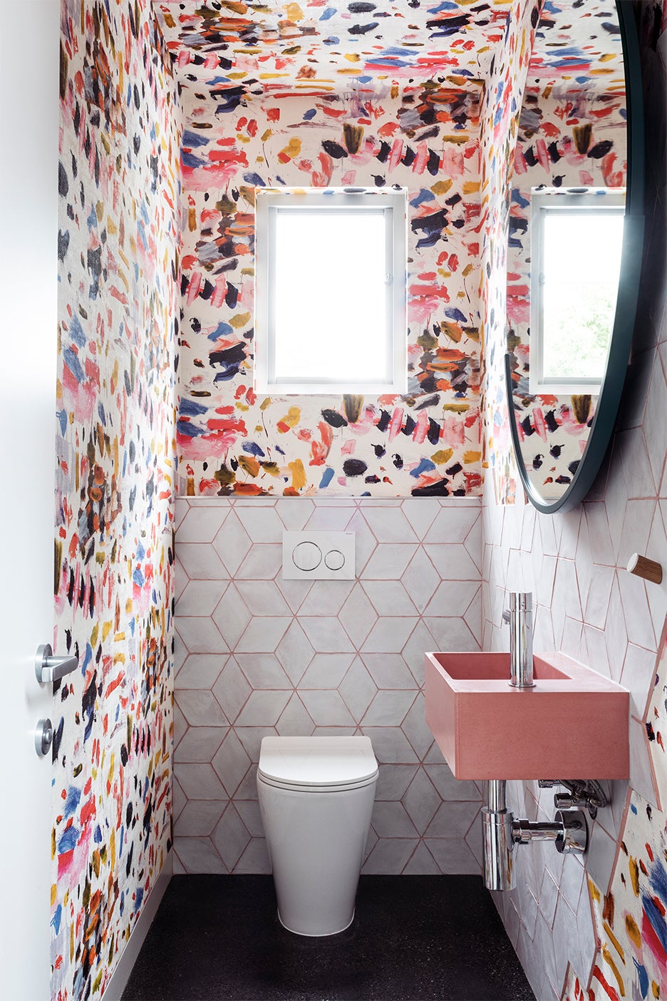 bathroom with rainbow brushstroke wallpaper