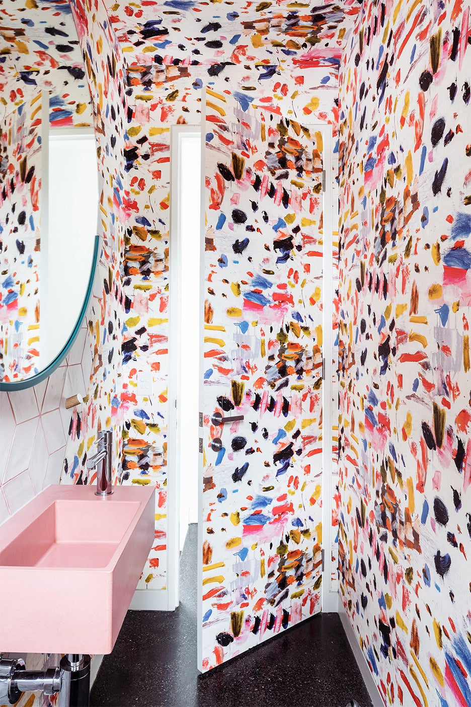 bathroom with rainbow brushstroke wallpaper