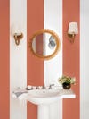 white and pink striped bathroom