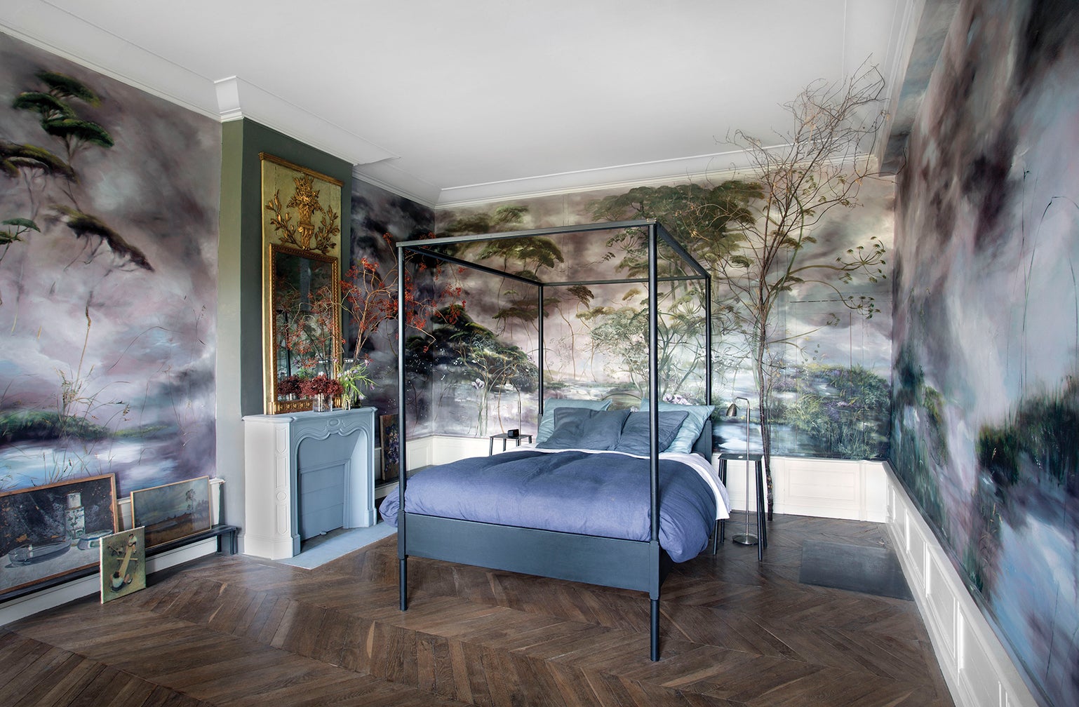 Bedroom with painted mural and branches