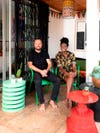 two designers sitting on colorful furniture