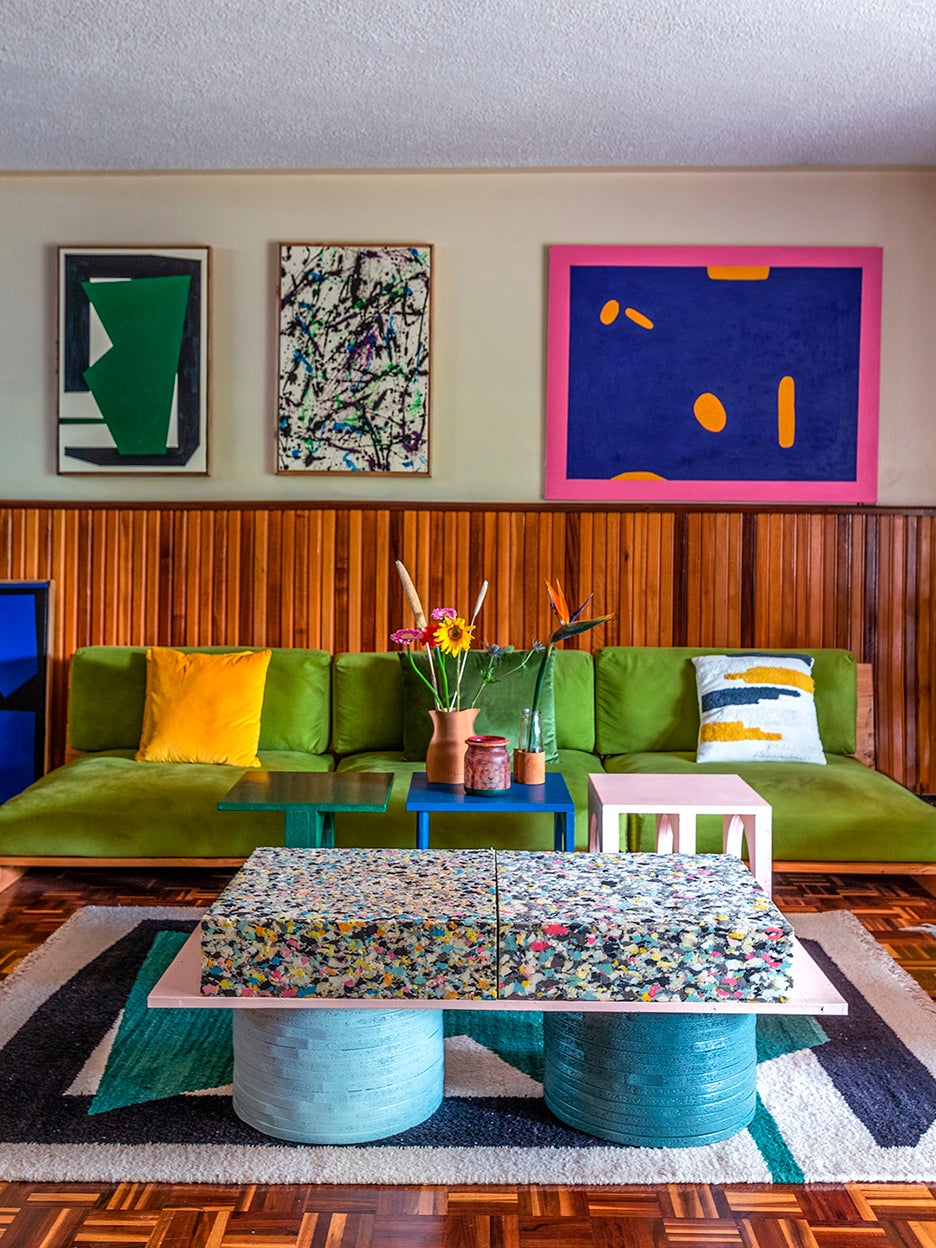 pea green velvet sofa in colorful living room