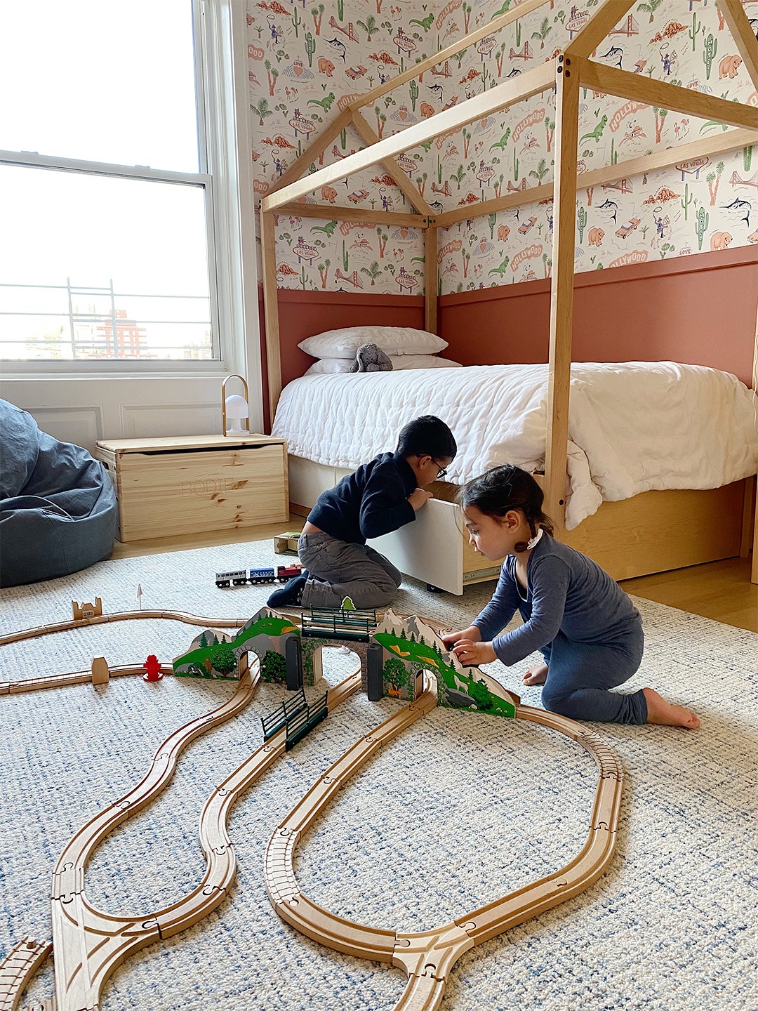 kids playing with toy trains