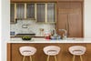 wood kitchen with pink bar stools