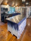 kitchen with blue skirted island