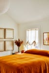 bedroom with orange duvet