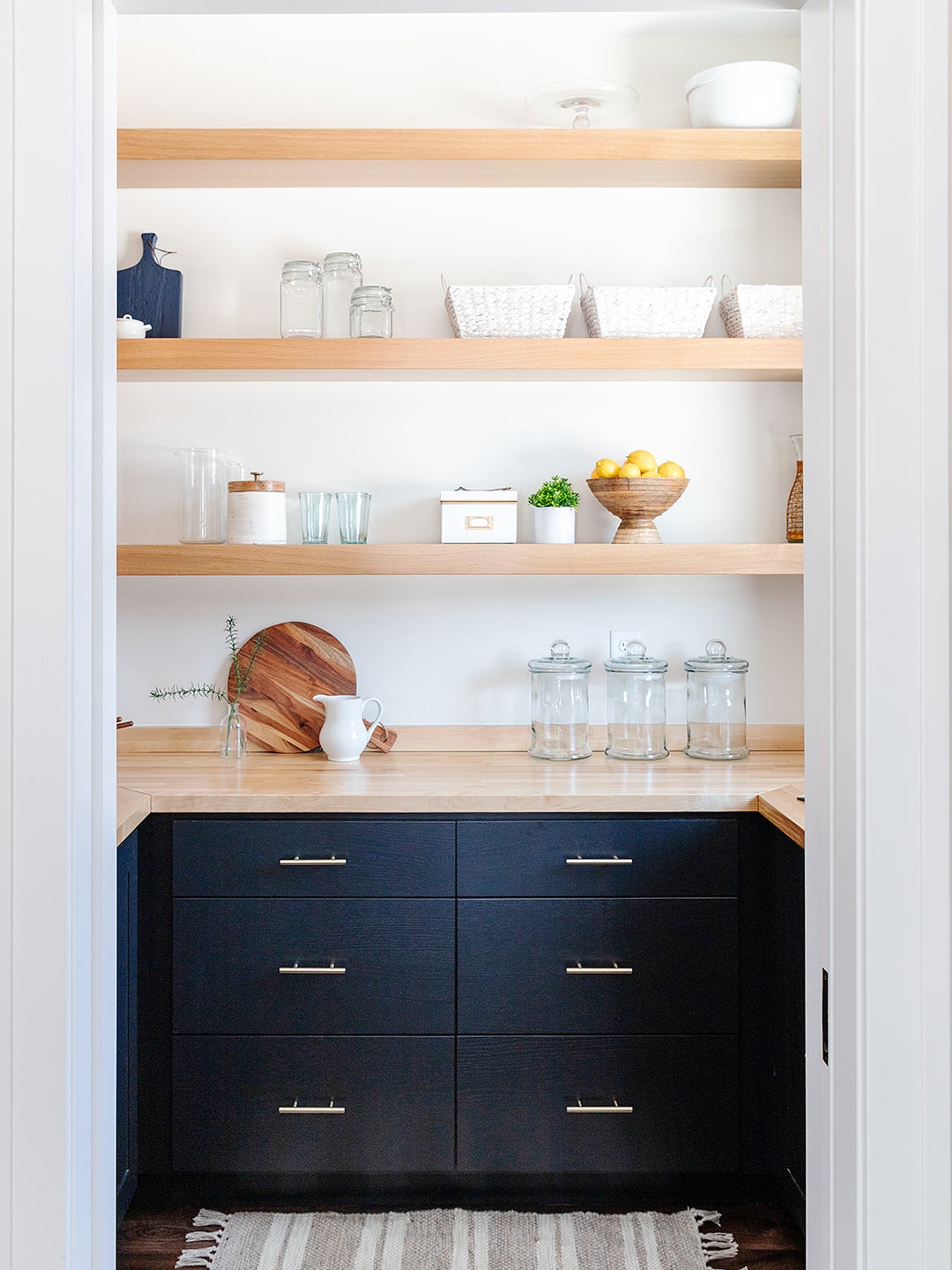 navy pantry with wood open shelving