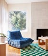 blue togo chair by window