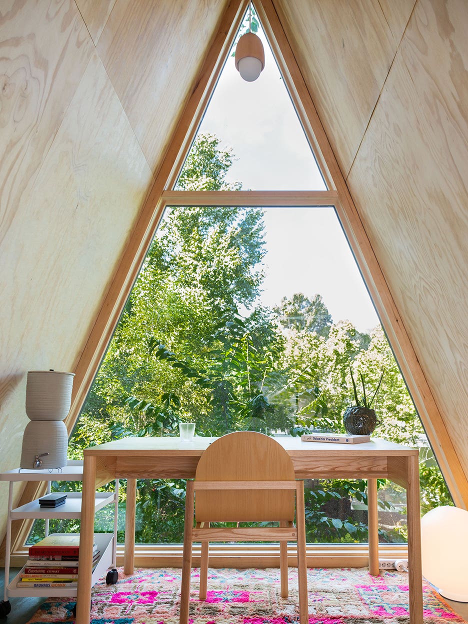 A-frame office with view of trees