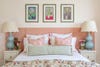 bed with pink upholstered headboard