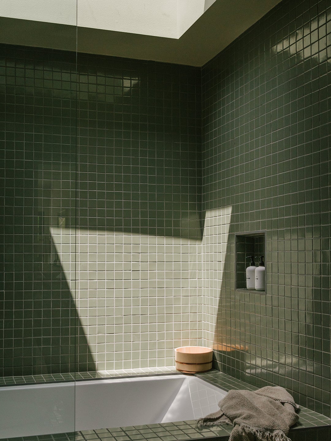 sage green tiled bathroom