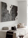 black and white art over sofa