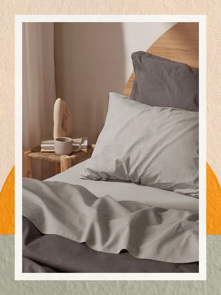 Gray percale sheets on a bed